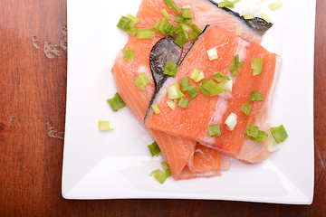 Image showing salmon filet with fresh herbs