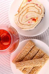 Image showing sweet cake on white plate and red wine