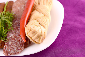 Image showing salami with pieces of cheese and red pepper