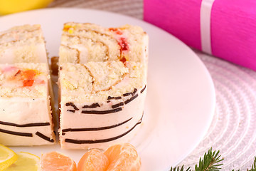 Image showing sweet cake on white plate and fruits