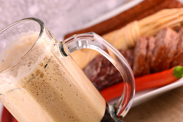 Image showing cup of beer, salami and red pepper