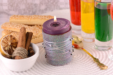 Image showing candles, cake and cinnamon