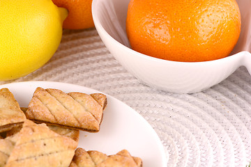 Image showing sweet cake on white plate and fruits