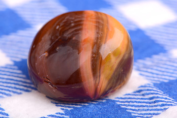 Image showing Close up stone on white and blue material