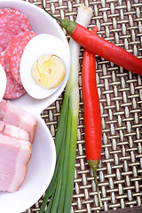 Image showing salami with pieces of cheese and red pepper