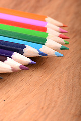 Image showing colored pencils  on wooden background