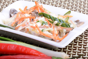 Image showing fresh salad on white plate and red pepper