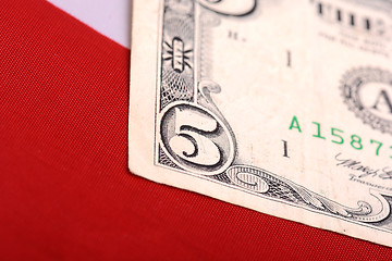 Image showing dollars on american flag