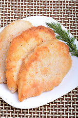 Image showing Fresh chicken chop and green parsley