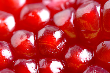 Image showing Pomegranate background. Macro of peeled ripe seeds