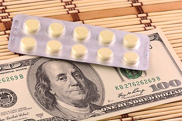 Image showing Pills and american money close-up background