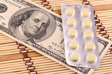 Image showing Pills and american money close-up background