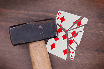 Image showing Hammer with a broken card, nine of diamond