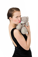 Image showing attractive smiling brunette holding teddy bear