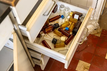 Image showing Cupboard with opened drawer