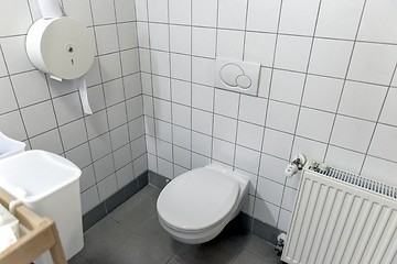 Image showing Opened door with toilet