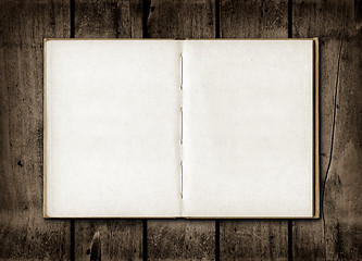 Image showing Note book on a dark wood background