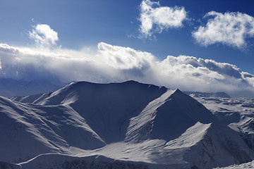 Image showing Snow mountains and sunlight clouds in evening