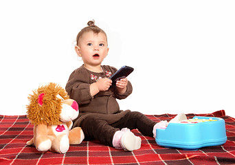 Image showing Baby playing with cell phone.