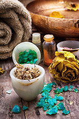 Image showing bronze bowl with water and accessories spa treatments