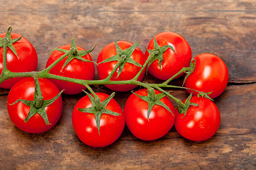 Image showing fresh cherry tomatoes on a cluster