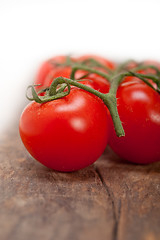 Image showing fresh cherry tomatoes on a cluster