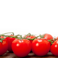 Image showing fresh cherry tomatoes on a cluster