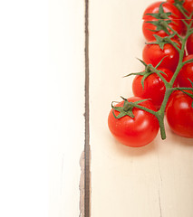 Image showing fresh cherry tomatoes on a cluster