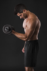 Image showing Muscular man lifting weights