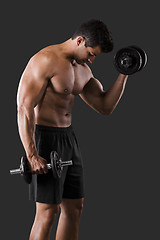 Image showing Muscular man lifting weights