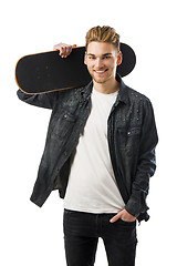 Image showing Young man with a skateboard