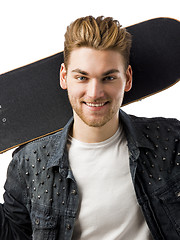 Image showing Young man with a skateboard