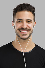 Image showing Man smiling and listen music