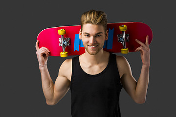 Image showing Young man with a skateboard