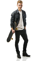 Image showing Young man with a skateboard