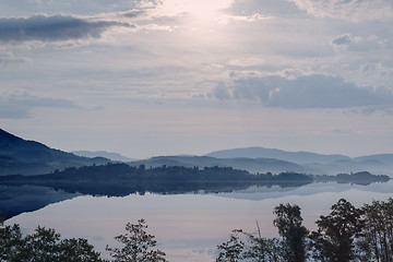 Image showing Hazy Sunrise in mountain lake