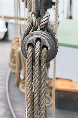 Image showing Wooden sailboat pulleys and ropes detail