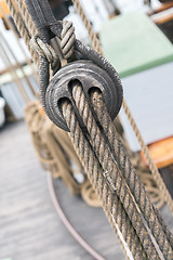 Image showing Wooden sailboat pulleys and ropes detail