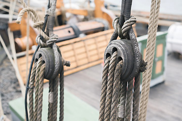 Image showing Wooden sailboat pulleys and ropes detail