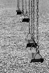 Image showing playground swings in black and white