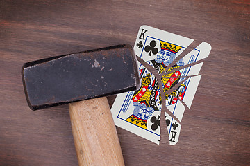 Image showing Hammer with a broken card, king of clubs
