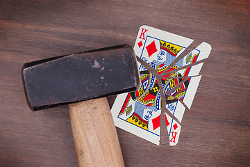 Image showing Hammer with a broken card, king of diamonds