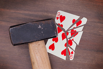 Image showing Hammer with a broken card, nine of hearts