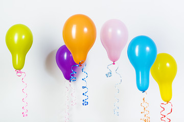 Image showing Balloons of different bright colors on a white background