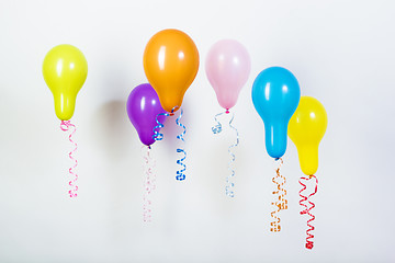 Image showing Balloons of different bright colors on a white background