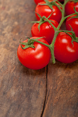 Image showing fresh cherry tomatoes on a cluster