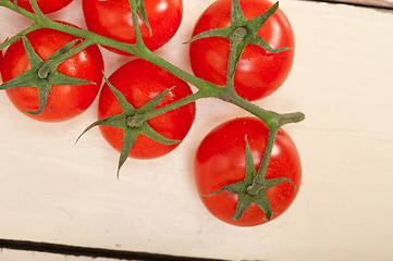 Image showing fresh cherry tomatoes on a cluster