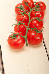 Image showing fresh cherry tomatoes on a cluster