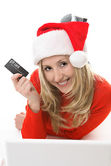 Image showing Santa Girl shopping with a card