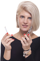 Image showing Blond Woman Holding a Tobacco and E-Cigarette